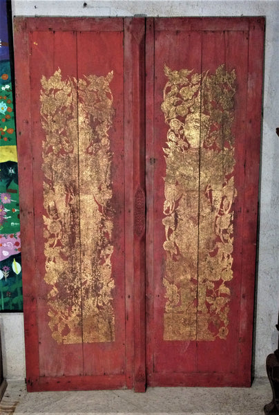 Southeast Asian red painted and gold leafed pair of doors.