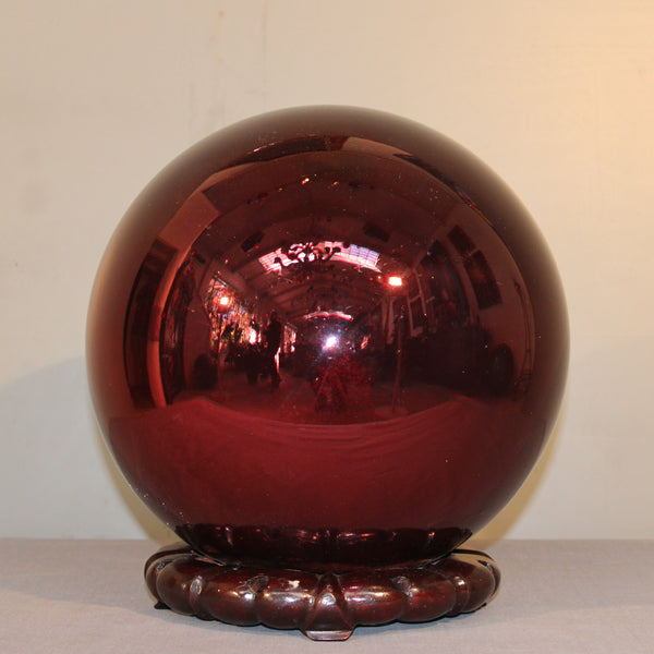 Witches Ball in a Burgundy Color.