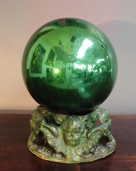 Witches ball on green glazed clay base from Michoacan Mexico.
