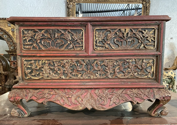 Red painted and gold leafed Chest with drawers from Indonesia.